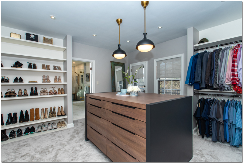 dressing room renovation with custom cabinetry and shoe shelves
